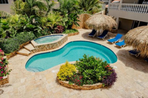 Gorgeous modern 2-bedroom apartment with tropical garden, pool and jacuzzi
